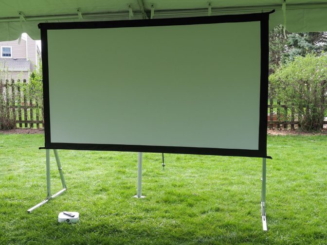 Outdoor Projector Outdoor projector and screen in a tent